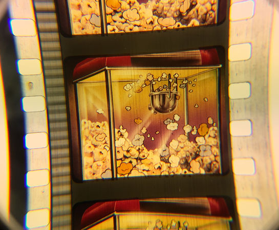 A Technicolor snipe advertising popcorn.
